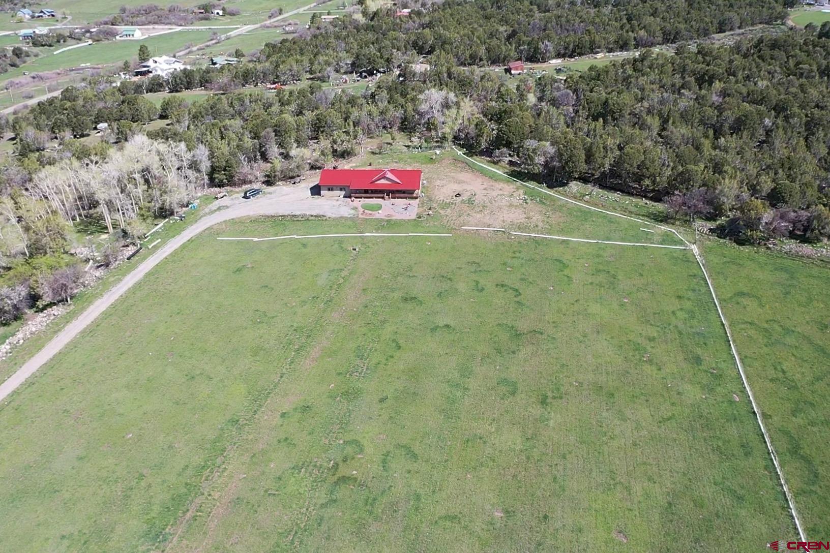 23105 U Road Cedaredge, CO 81413 - Photo 31 of 33 a view of a tennis ground with large trees