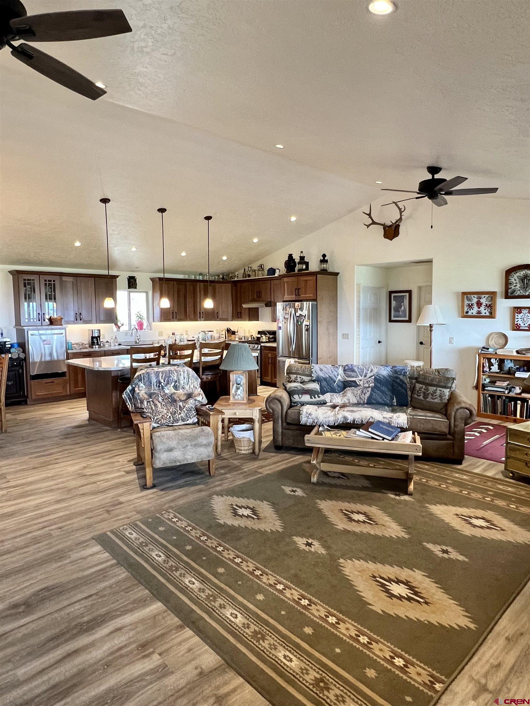 23105 U Road Cedaredge, CO 81413 - Photo 5 of 33 a living room with lots of furniture and view of kitchen