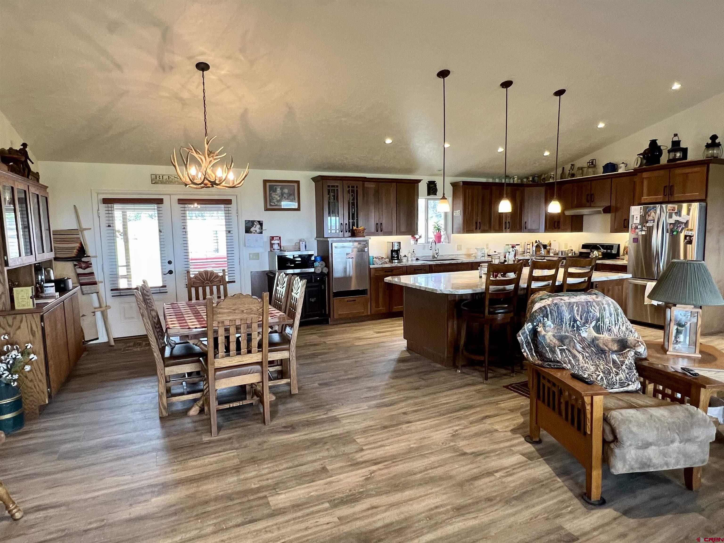 23105 U Road Cedaredge, CO 81413 - Photo 6 of 33 a living room with lots of furniture and kitchen view