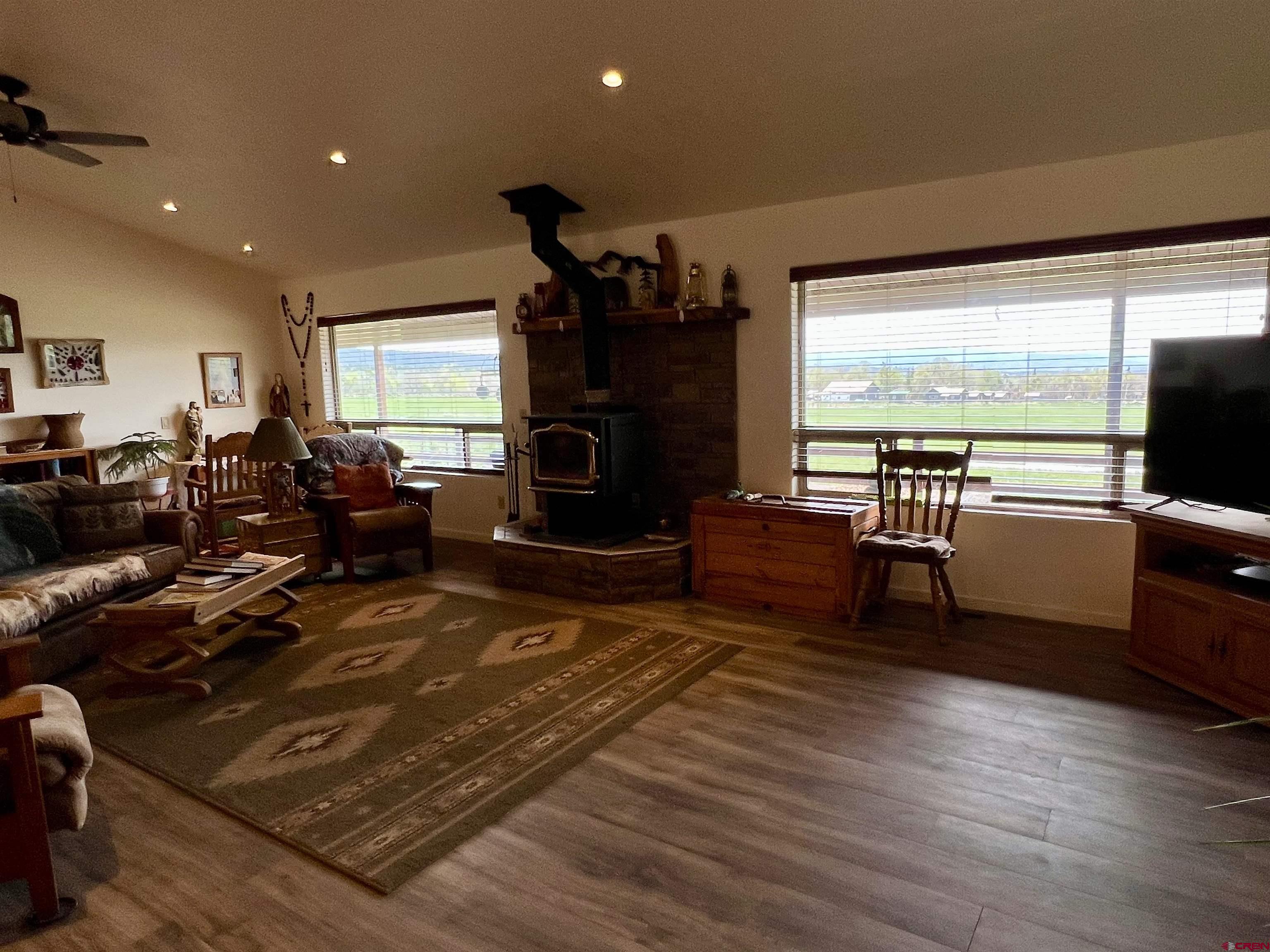 23105 U Road Cedaredge, CO 81413 - Photo 7 of 33 a living room with furniture and a flat screen tv
