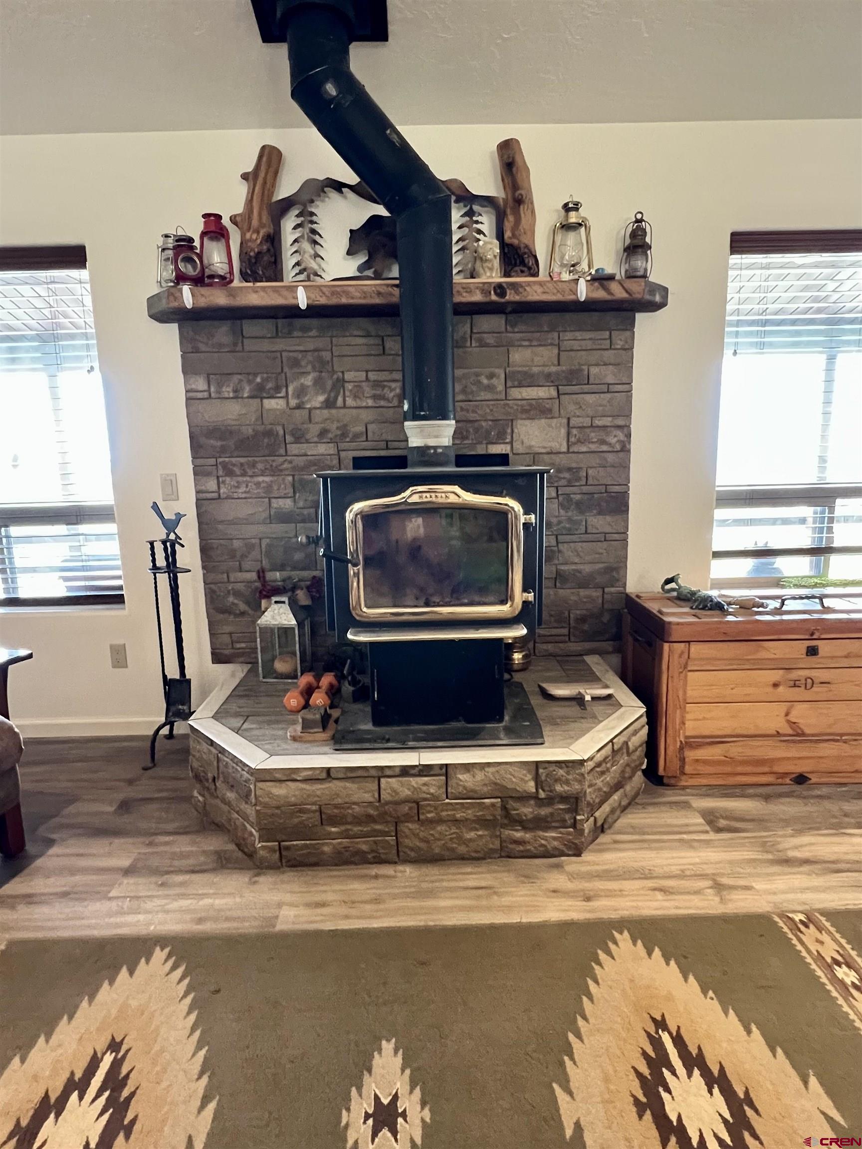 23105 U Road Cedaredge, CO 81413 - Photo 8 of 33 a living room with furniture and a fireplace