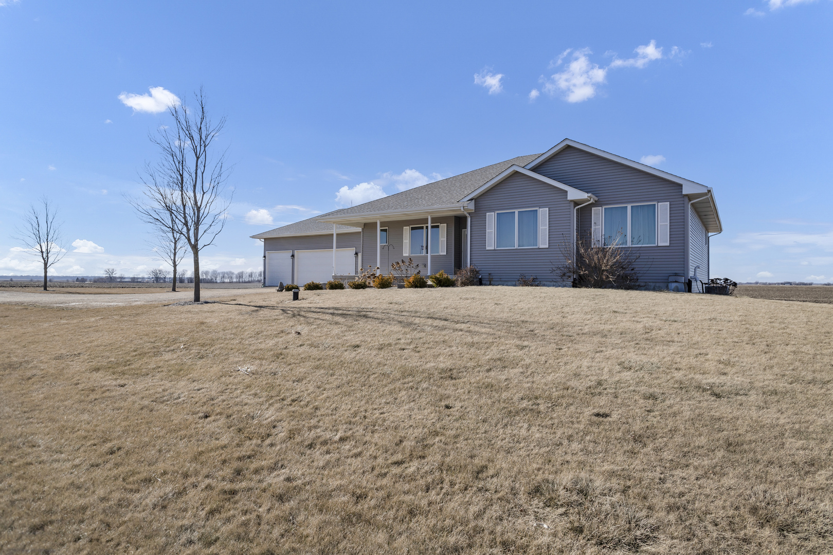 34765 Jefferson Road Genoa, IL 60135 - Photo 2 of 65 a front view of a house with a yard