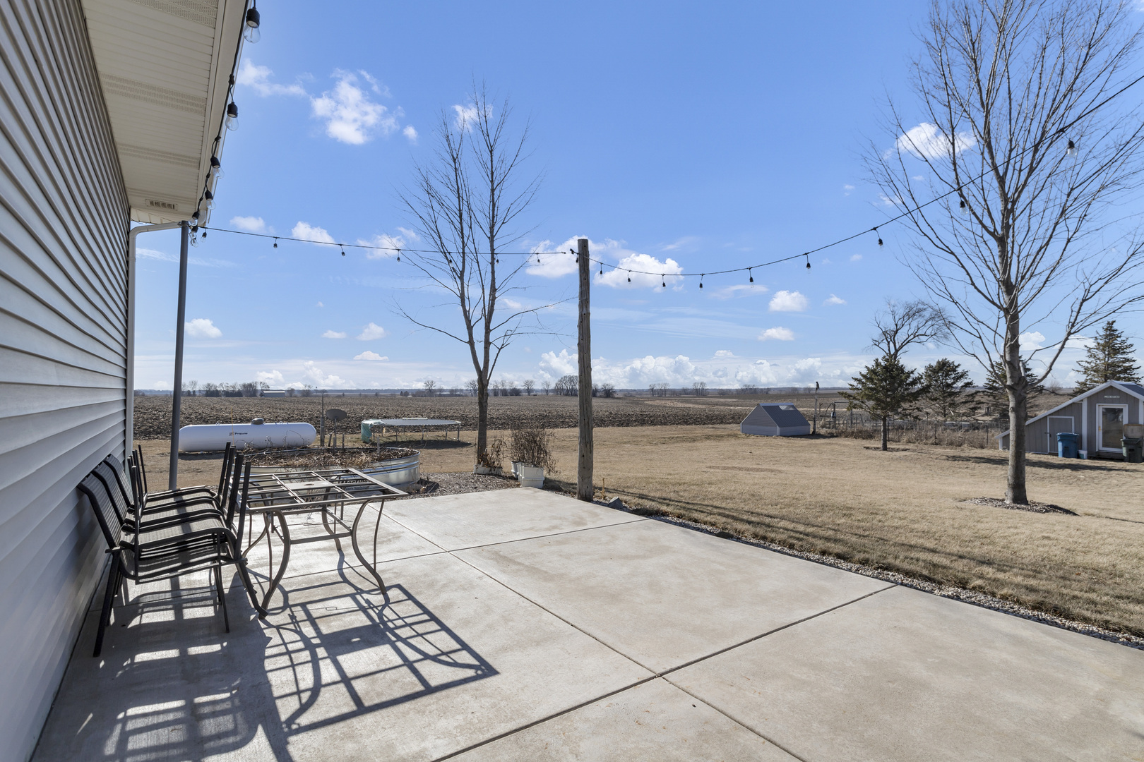 34765 Jefferson Road Genoa, IL 60135 - Photo 51 of 65 a view of terrace with seating space and trees