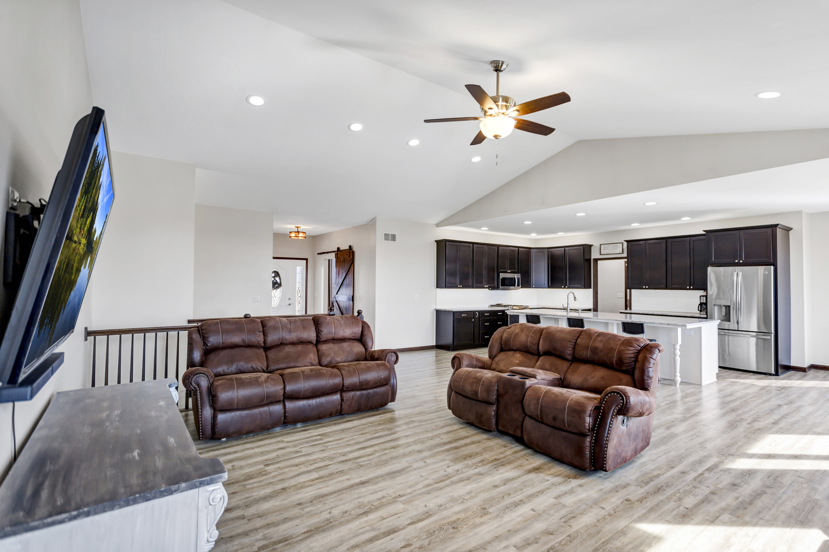34765 Jefferson Road Genoa, IL 60135 - Photo 9 of 65 a living room with furniture and a flat screen tv