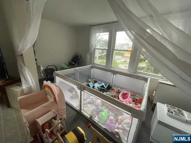 a storage room with furniture and a window