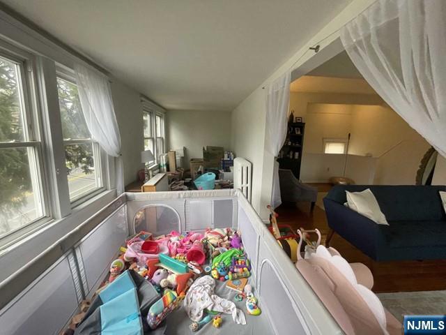 823 Anderson Avenue, Unit 2 Fort Lee, NJ 07024 - Photo 4 of 23 a living room with furniture and a large window
