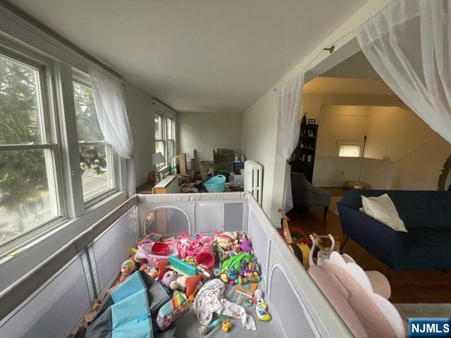 823 Anderson Avenue, Unit 2 Fort Lee, NJ 07024 - Photo 5 of 23 a living room with furniture and a potted plant