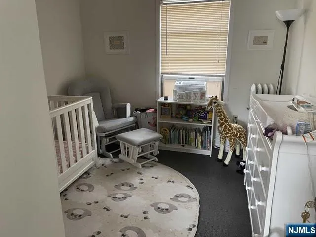 a living room with furniture fireplace and window