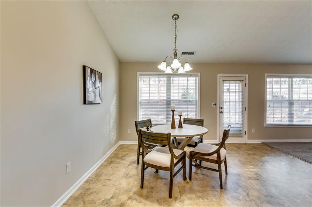 5602 Swanson Road Ellenwood, GA 30294 - Photo 15 of 36 a view of a dining room with furniture and window