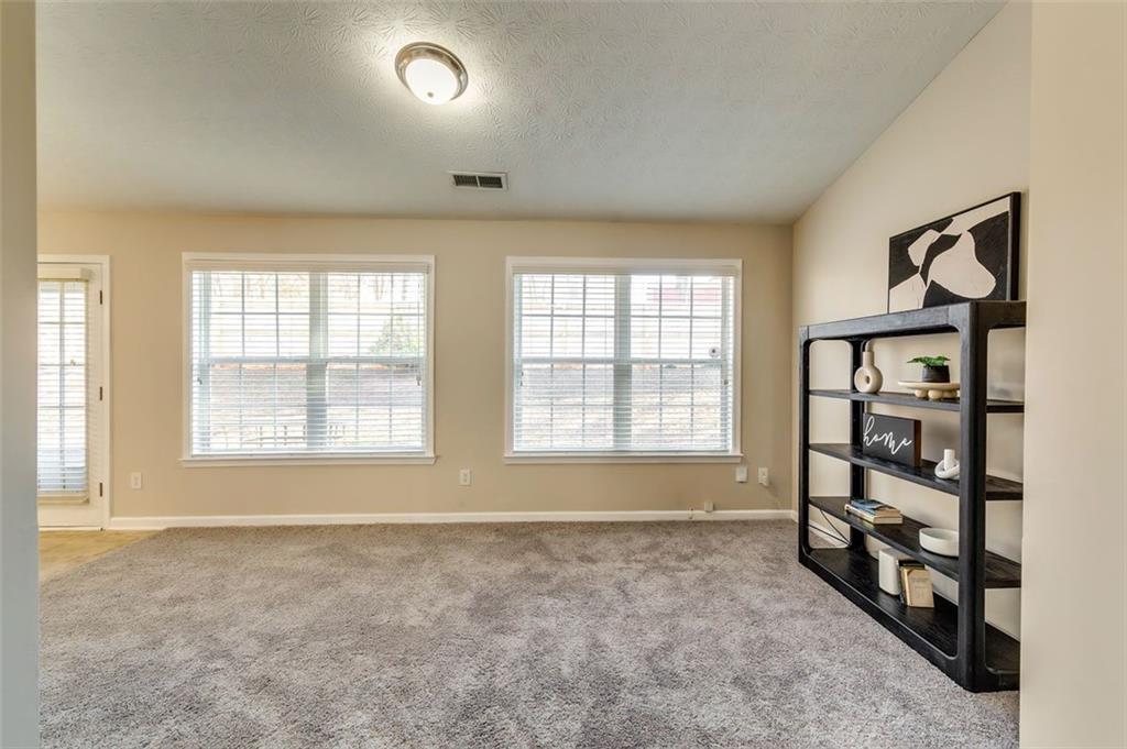 5602 Swanson Road Ellenwood, GA 30294 - Photo 18 of 36 a view of an empty room with a window