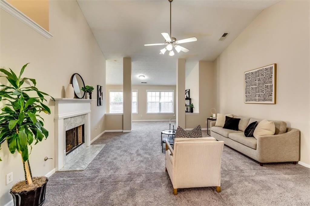 5602 Swanson Road Ellenwood, GA 30294 - Photo 2 of 36 a living room with furniture and a fireplace
