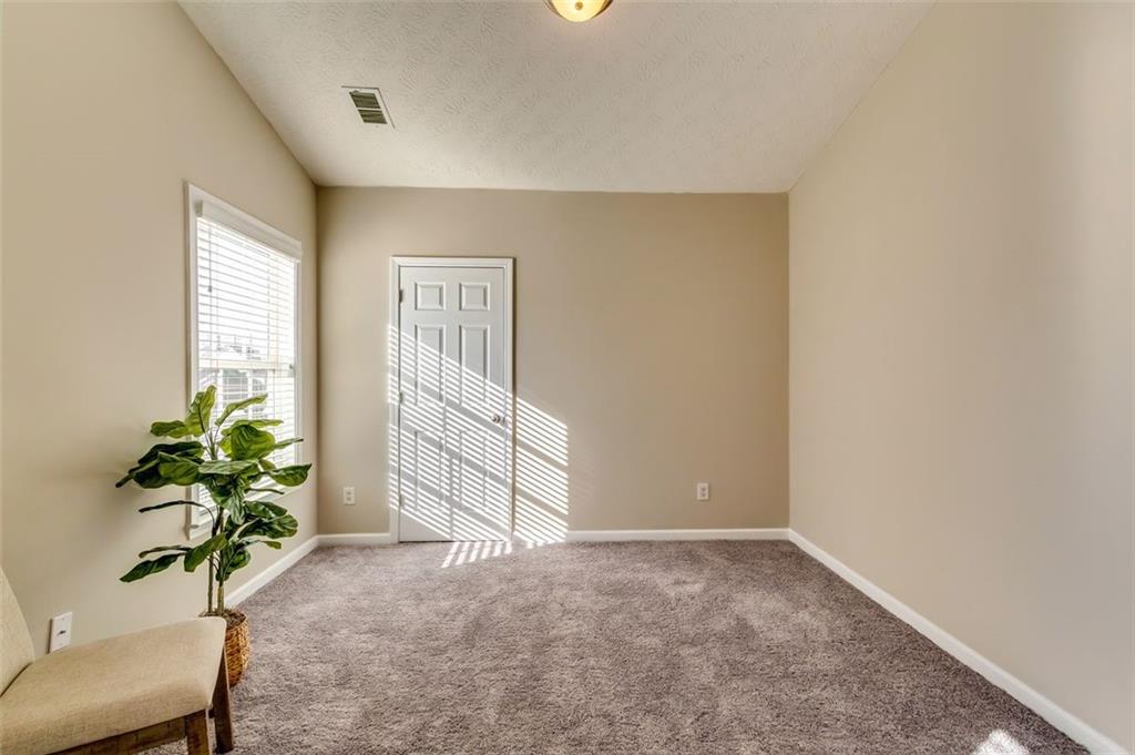 5602 Swanson Road Ellenwood, GA 30294 - Photo 22 of 36 a view of an empty room with a window