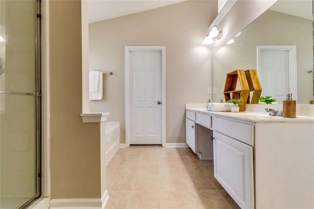 5602 Swanson Road Ellenwood, GA 30294 - Photo 25 of 36 a bathroom with a sink vanity and mirror