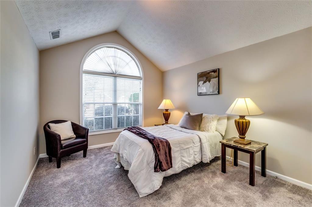 5602 Swanson Road Ellenwood, GA 30294 - Photo 27 of 36 a bedroom with a bed chair and window