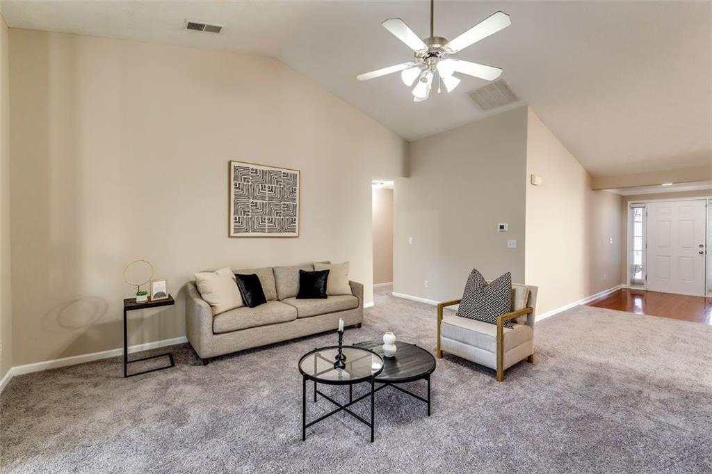 5602 Swanson Road Ellenwood, GA 30294 - Photo 7 of 36 a living room with furniture and white walls