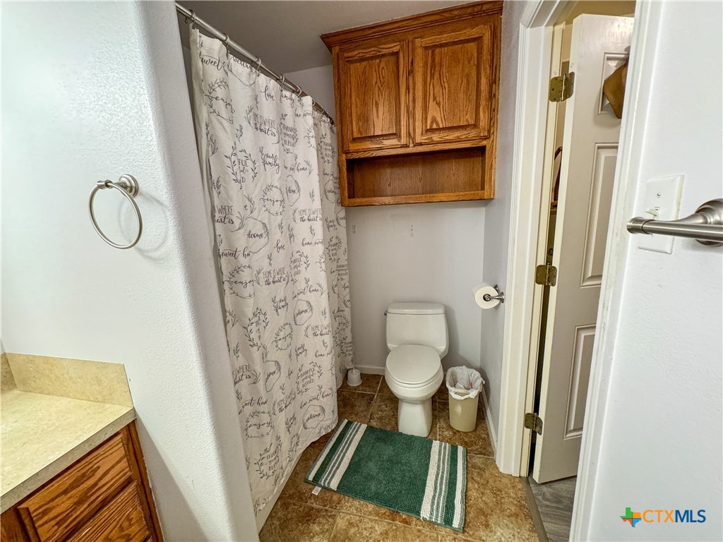 2507 Boyd Road Port Lavaca, TX 77979 - Photo 37 of 47 a bathroom with a granite countertop sink toilet and shower