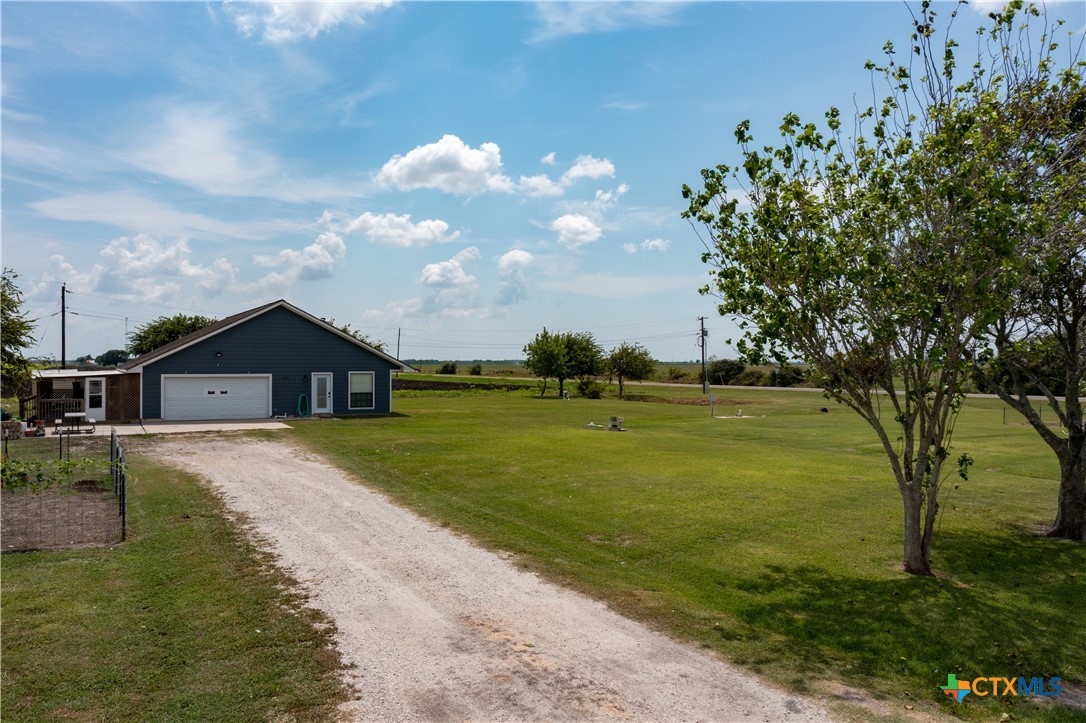 2507 Boyd Road Port Lavaca, TX 77979 - Photo 44 of 47 a view of a big house with a big yard and large trees