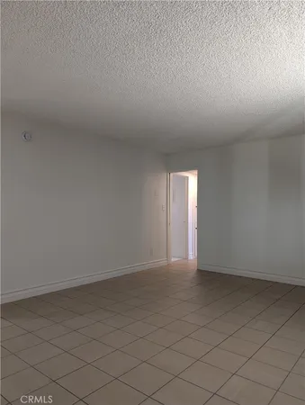 a view of an empty room and a window