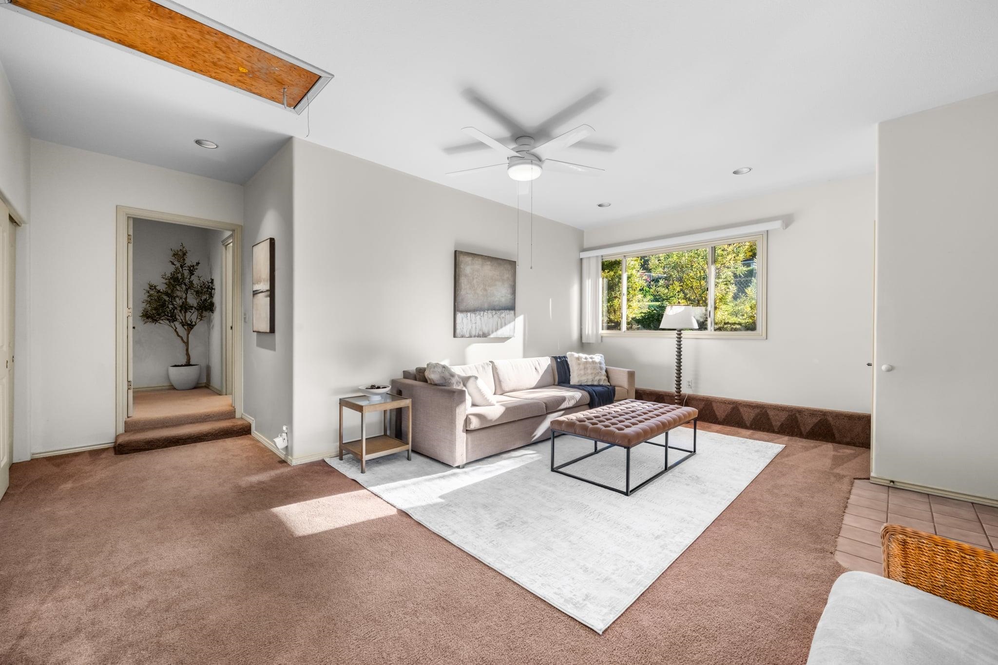 33 Puakea Place Kula, HI 96790 - Photo 19 of 48 a living room with furniture and a large window