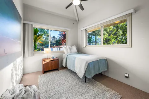 a bed room with a bed and a couch