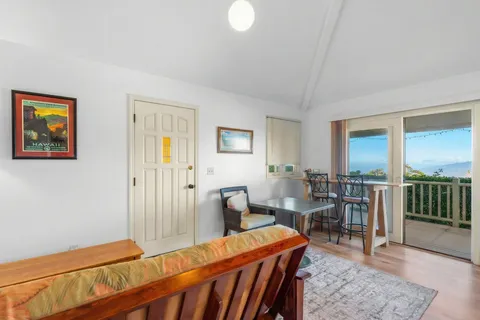 a view of a balcony with wooden floor