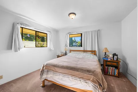 a bed room with furniture and a window