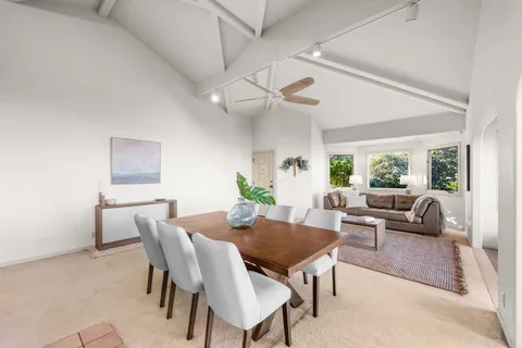 a view of a dining room with furniture window and outside view