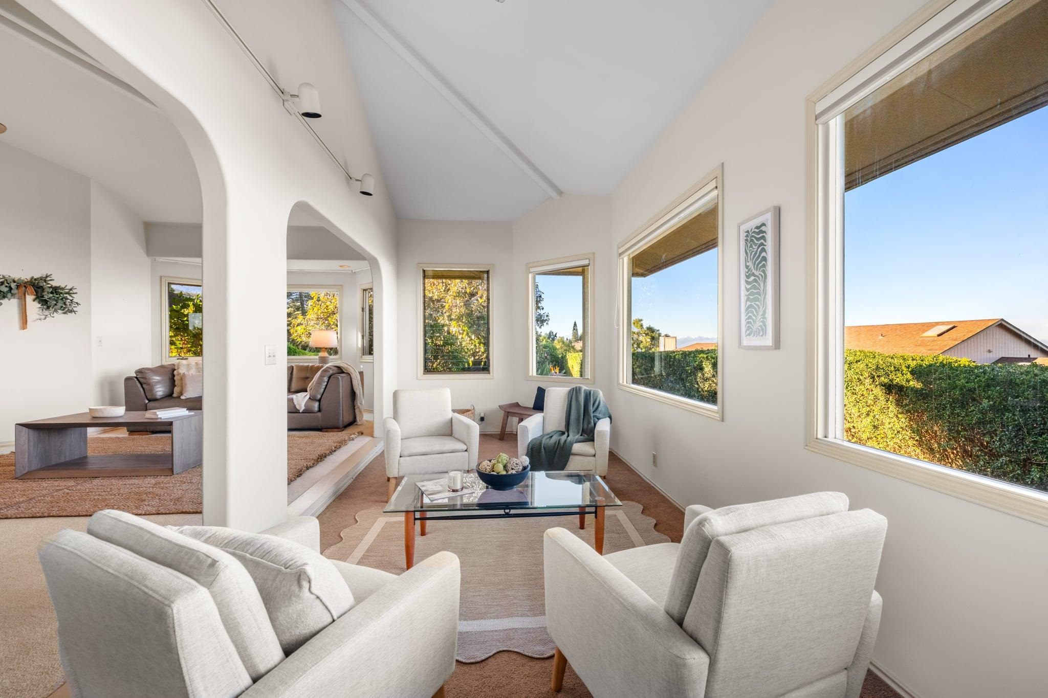 33 Puakea Place Kula, HI 96790 - Photo 10 of 48 a living room with furniture and a large window