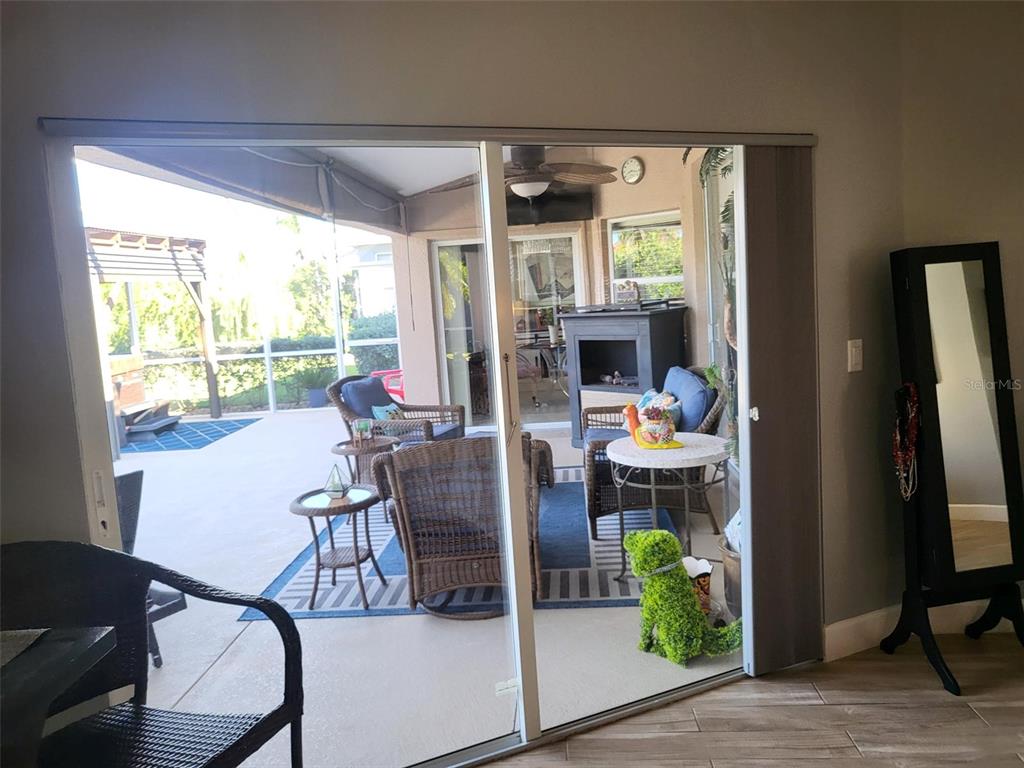 107 Wading Bird Drive Venice, FL 34292 - Photo 13 of 33 a dining room with furniture water view and a floor to ceiling window