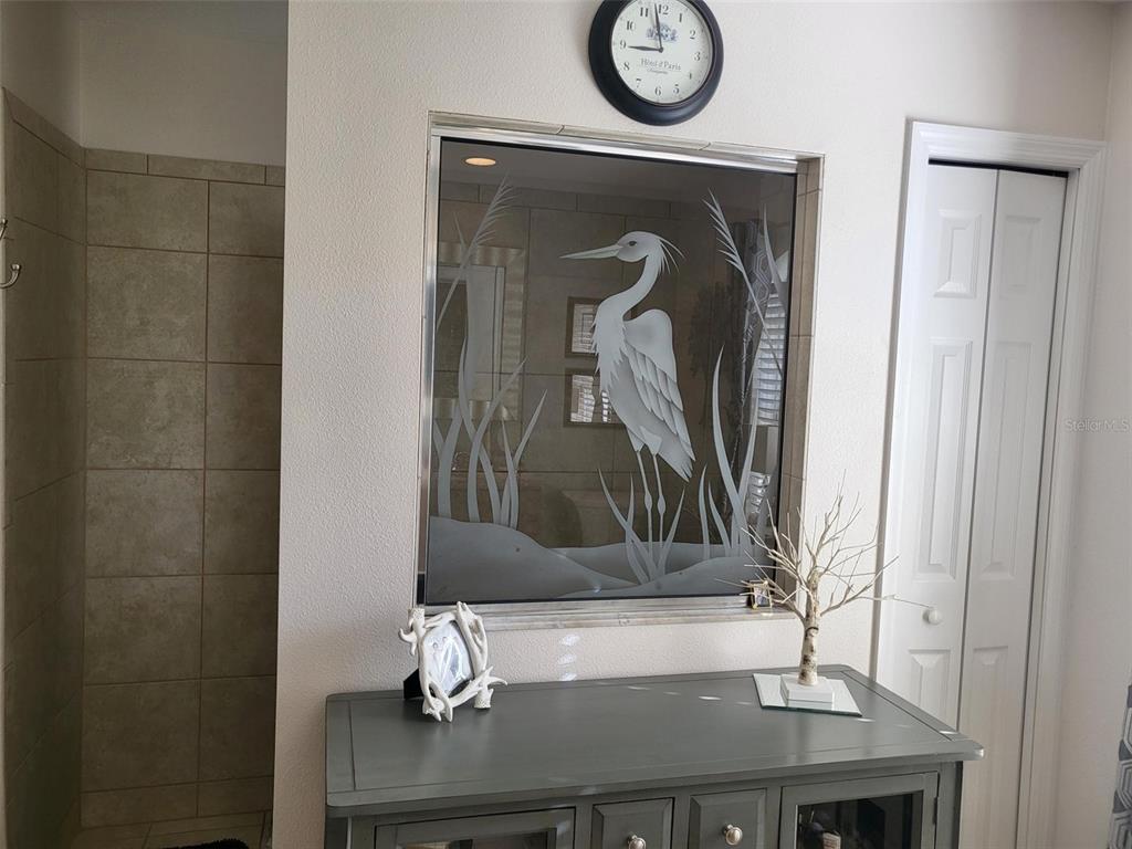 107 Wading Bird Drive Venice, FL 34292 - Photo 19 of 33 a bathroom with a sink and a mirror