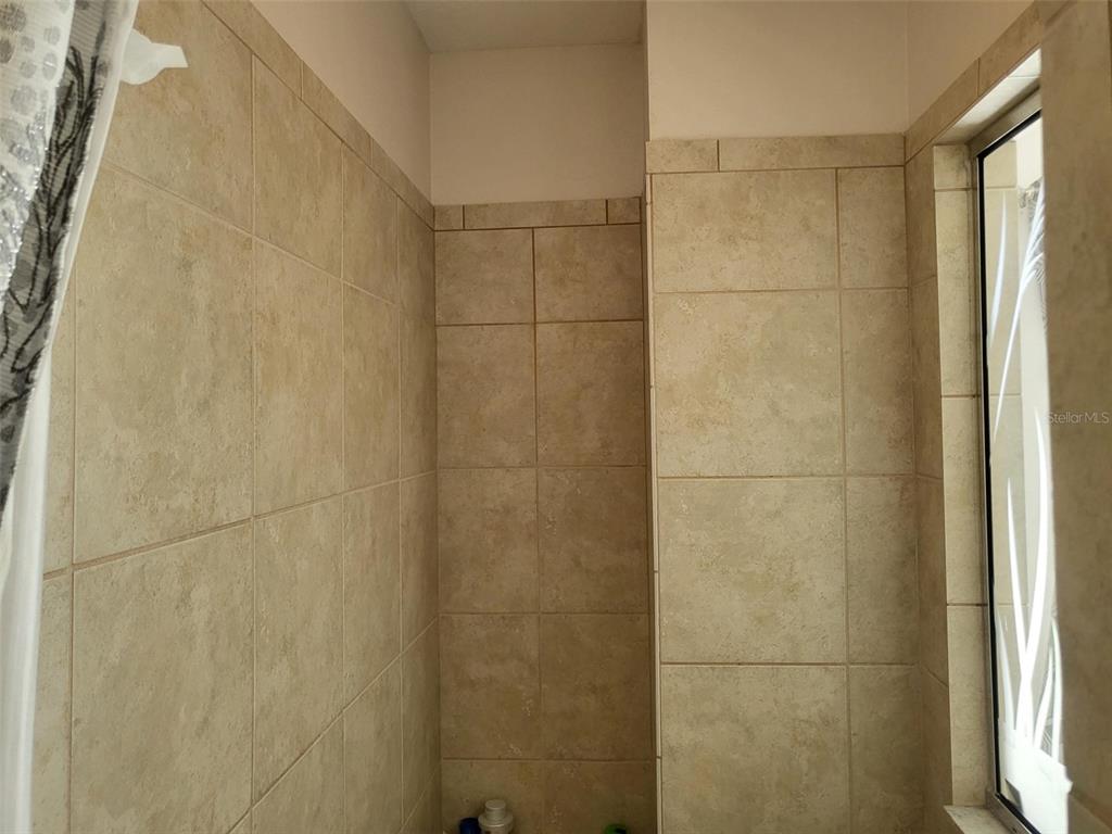 107 Wading Bird Drive Venice, FL 34292 - Photo 20 of 33 a bathroom with a shower