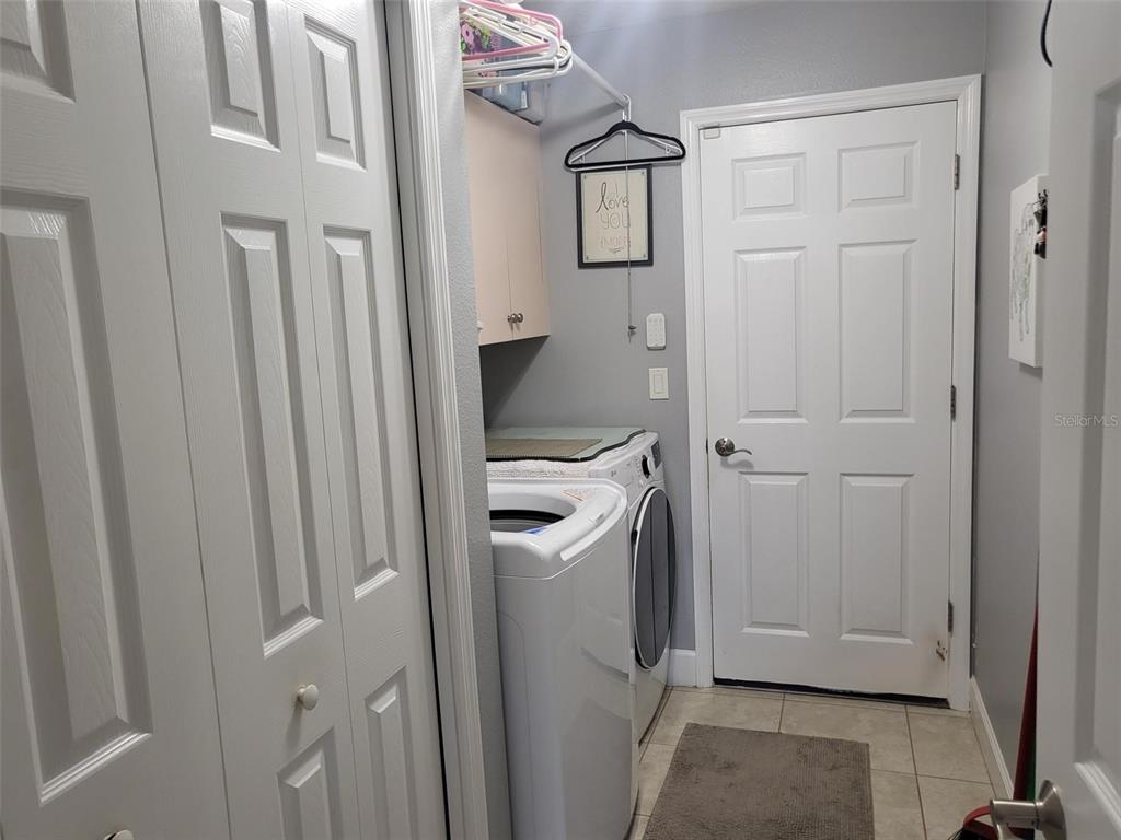 107 Wading Bird Drive Venice, FL 34292 - Photo 26 of 33 a view of a storage and utility room with a washer dryer