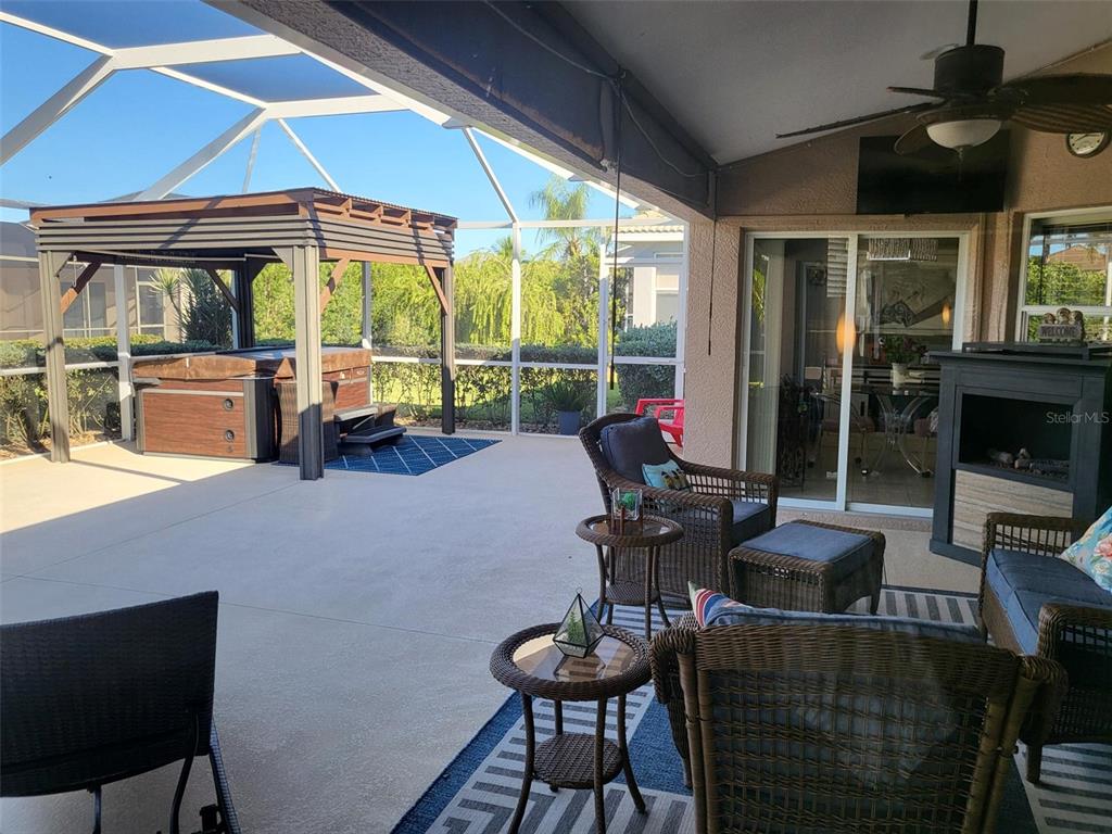 107 Wading Bird Drive Venice, FL 34292 - Photo 28 of 33 a living room with furniture and a floor to ceiling window