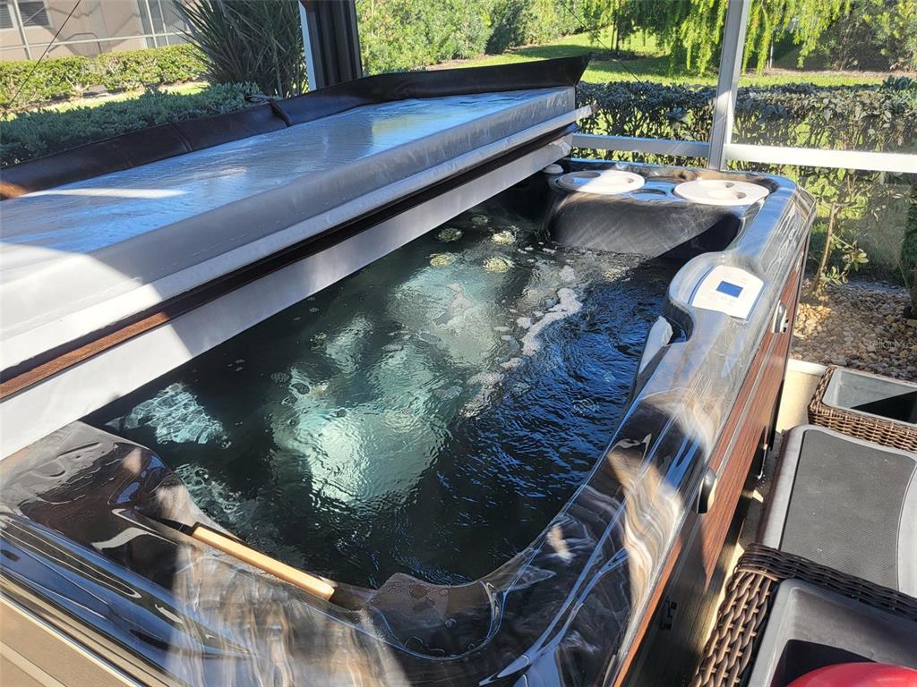 107 Wading Bird Drive Venice, FL 34292 - Photo 31 of 33 a balcony with chairs and a table