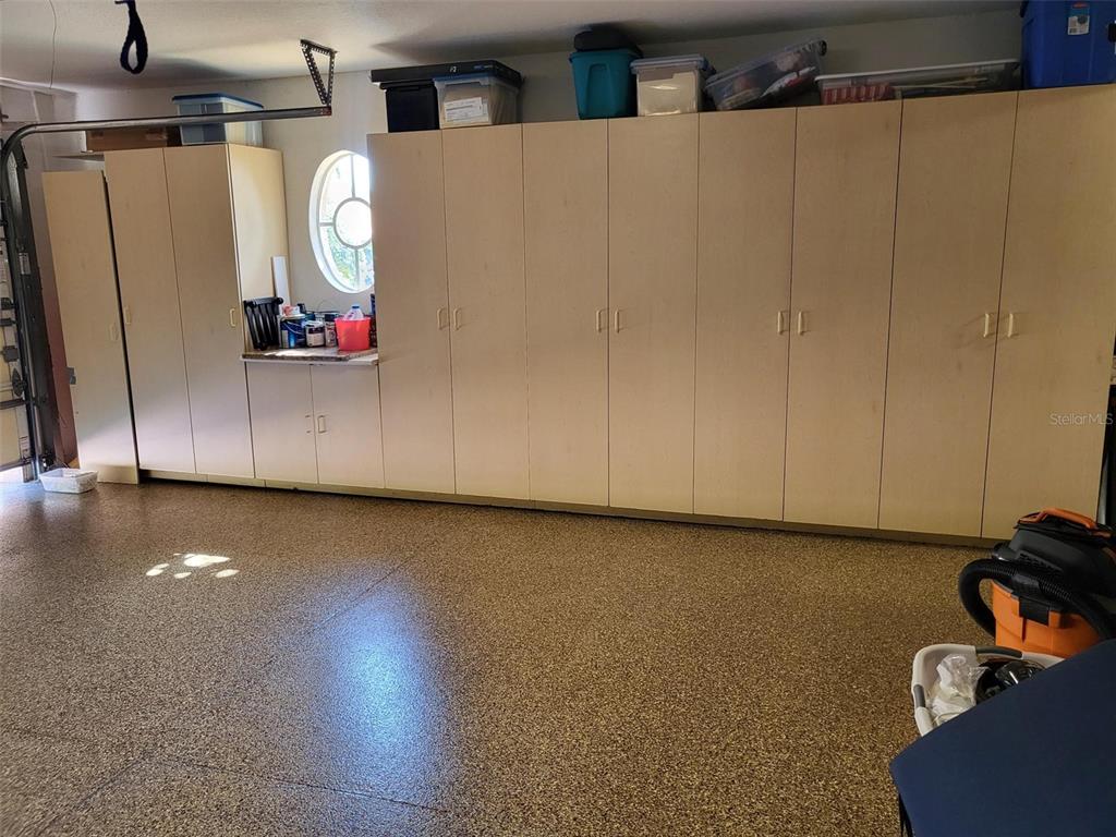 107 Wading Bird Drive Venice, FL 34292 - Photo 32 of 33 a view of a storage & utility room with wooden floor