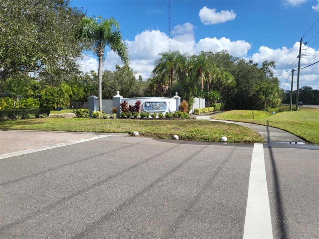 107 Wading Bird Drive Venice, FL 34292 - Photo 33 of 33 a front view of a house with a yard and trees