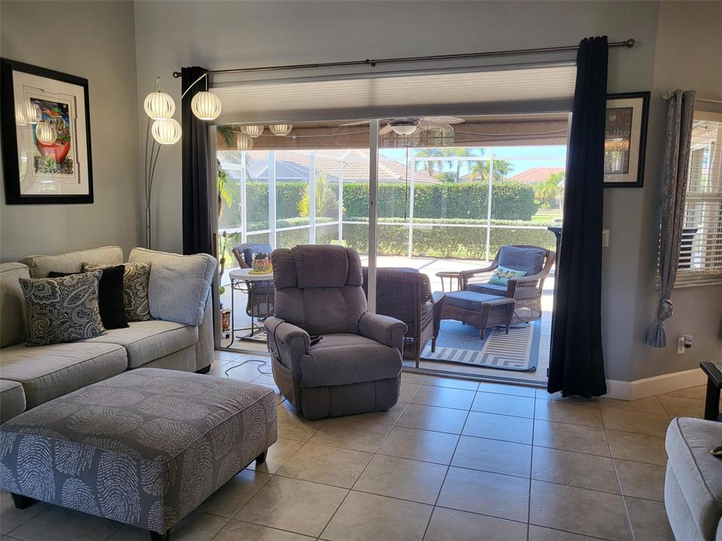 107 Wading Bird Drive Venice, FL 34292 - Photo 5 of 33 a living room with furniture and a large window