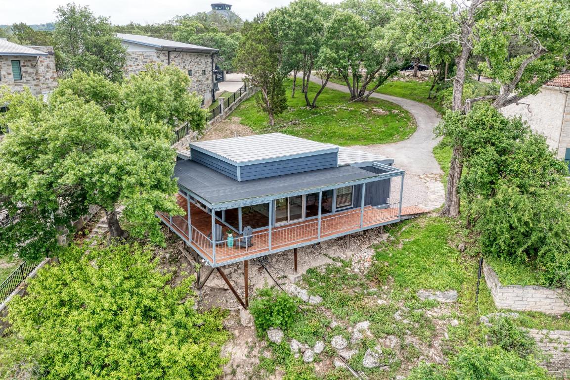 8130 Joy Road Volente, TX 78641 - Photo 29 of 36 View from above of property with a tree filled landscape