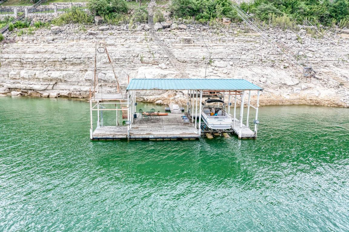 8130 Joy Road Volente, TX 78641 - Photo 32 of 36 Dock with boat lift and a water view