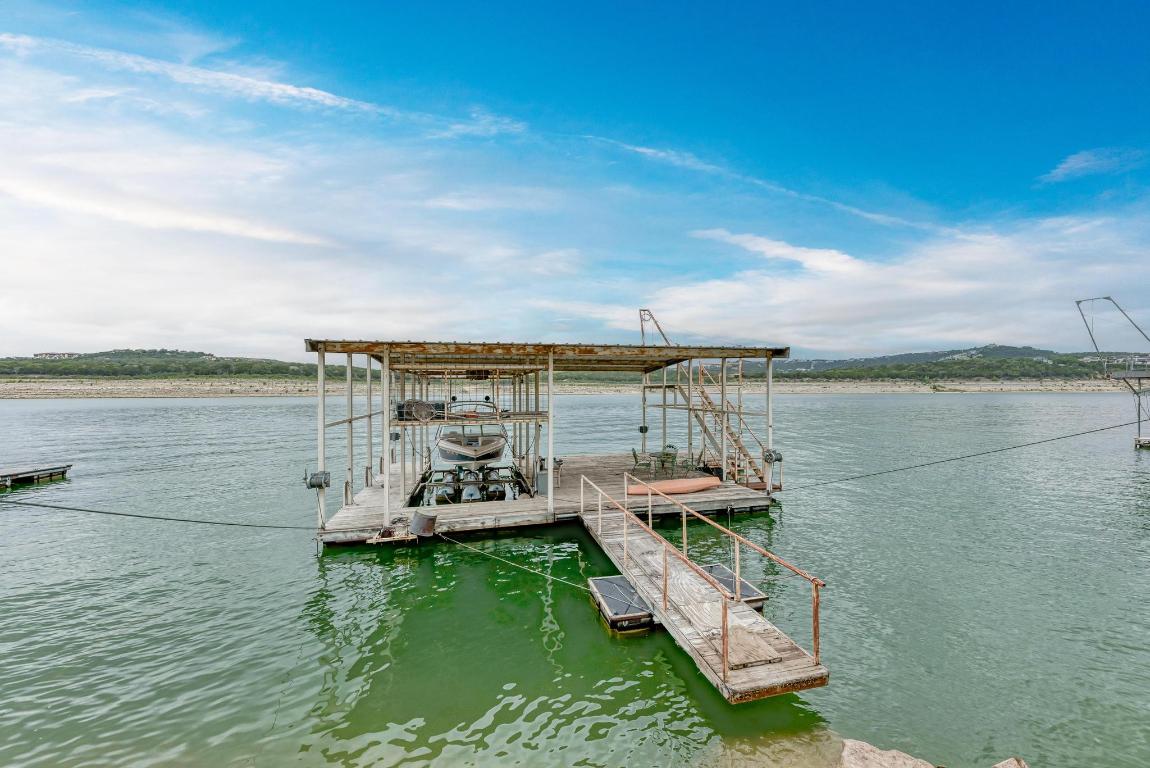 8130 Joy Road Volente, TX 78641 - Photo 35 of 36 Dock area featuring a water view and boat lift
