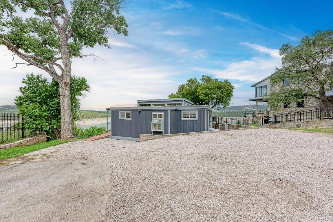 8130 Joy Road Volente, TX 78641 - Photo 6 of 36 View of outbuilding featuring driveway