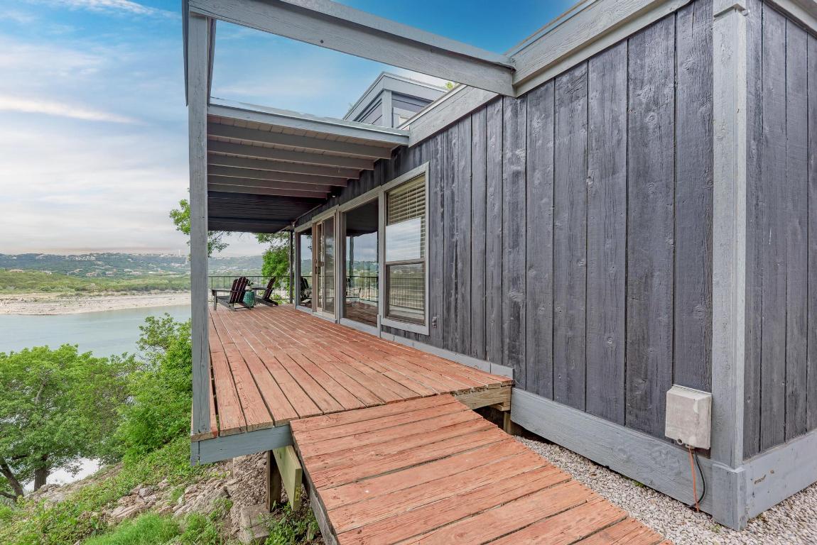 8130 Joy Road Volente, TX 78641 - Photo 8 of 36 Wooden terrace featuring a water view