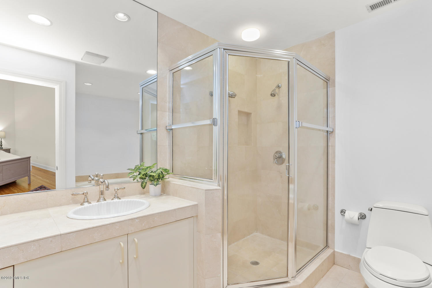 333 Palmer Hill Road, Unit 3C Riverside, CT 06878 - Photo 14 of 36 a bathroom with a shower sink vanity mirror and toilet