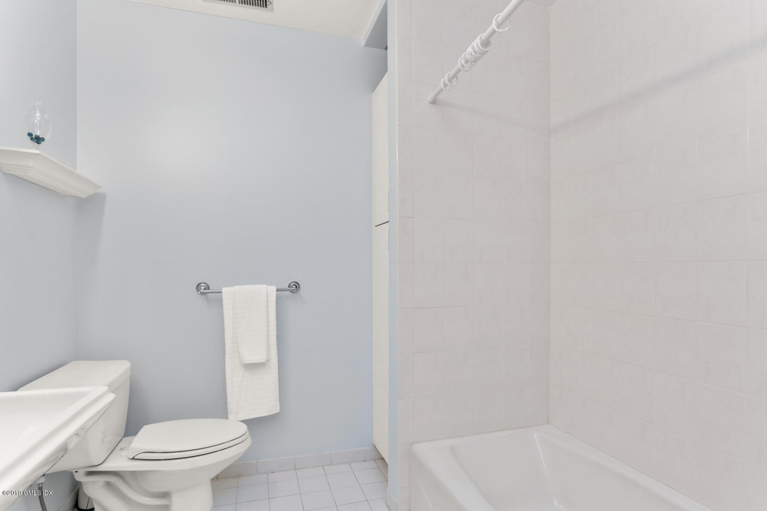 333 Palmer Hill Road, Unit 3C Riverside, CT 06878 - Photo 18 of 36 a white toilet sitting next to a bath tub