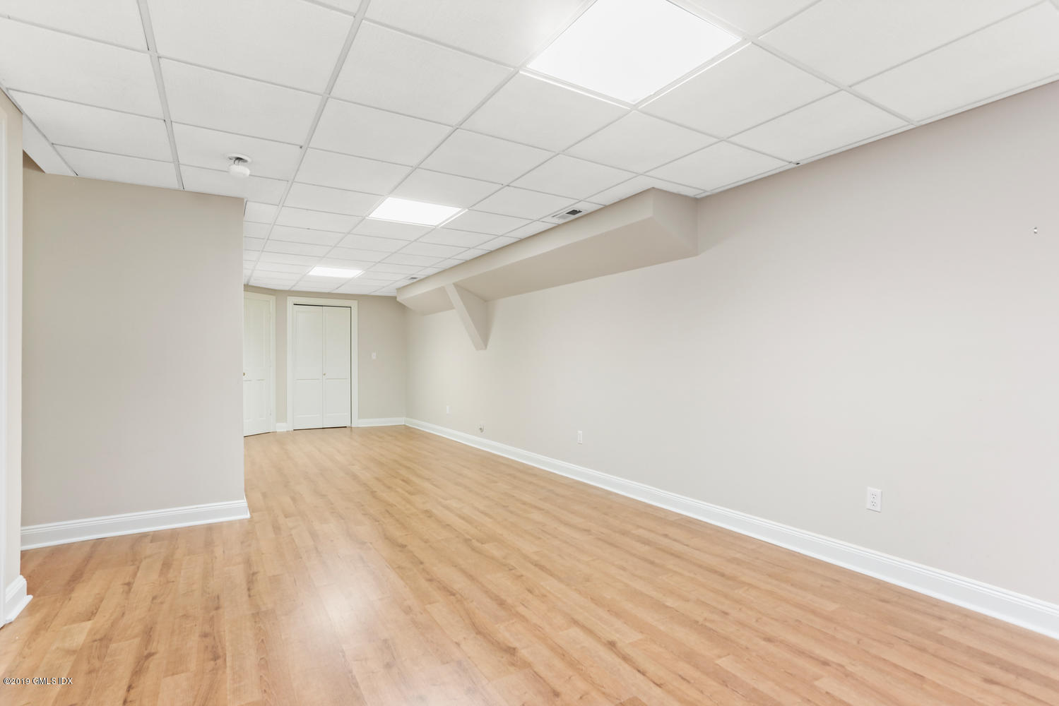 333 Palmer Hill Road, Unit 3C Riverside, CT 06878 - Photo 22 of 36 a view of empty room with wooden floor