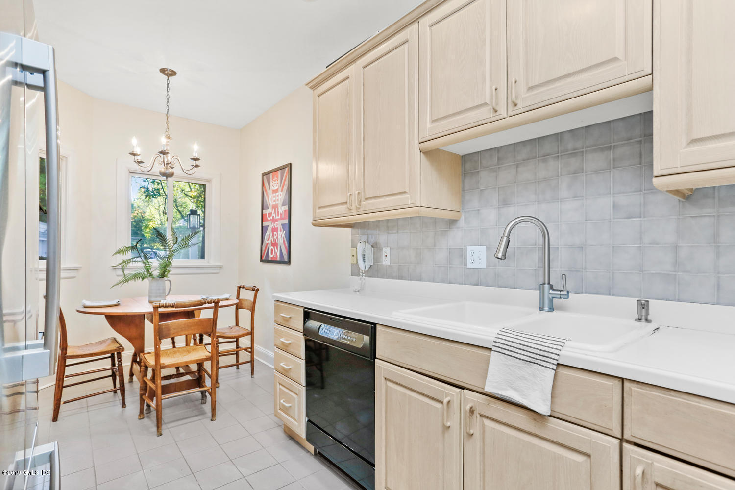 333 Palmer Hill Road, Unit 3C Riverside, CT 06878 - Photo 4 of 36 a kitchen with stainless steel appliances a sink stove and cabinets