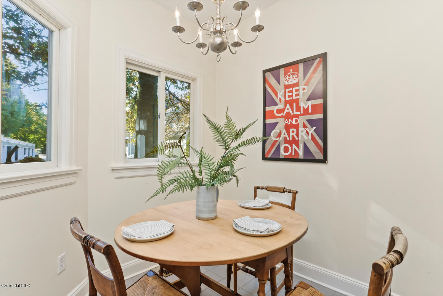 333 Palmer Hill Road, Unit 3C Riverside, CT 06878 - Photo 5 of 36 a view of a dining room with furniture window and wooden floor