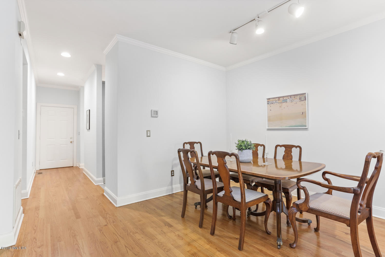 333 Palmer Hill Road, Unit 3C Riverside, CT 06878 - Photo 6 of 36 a view of a dining room with furniture and wooden floor
