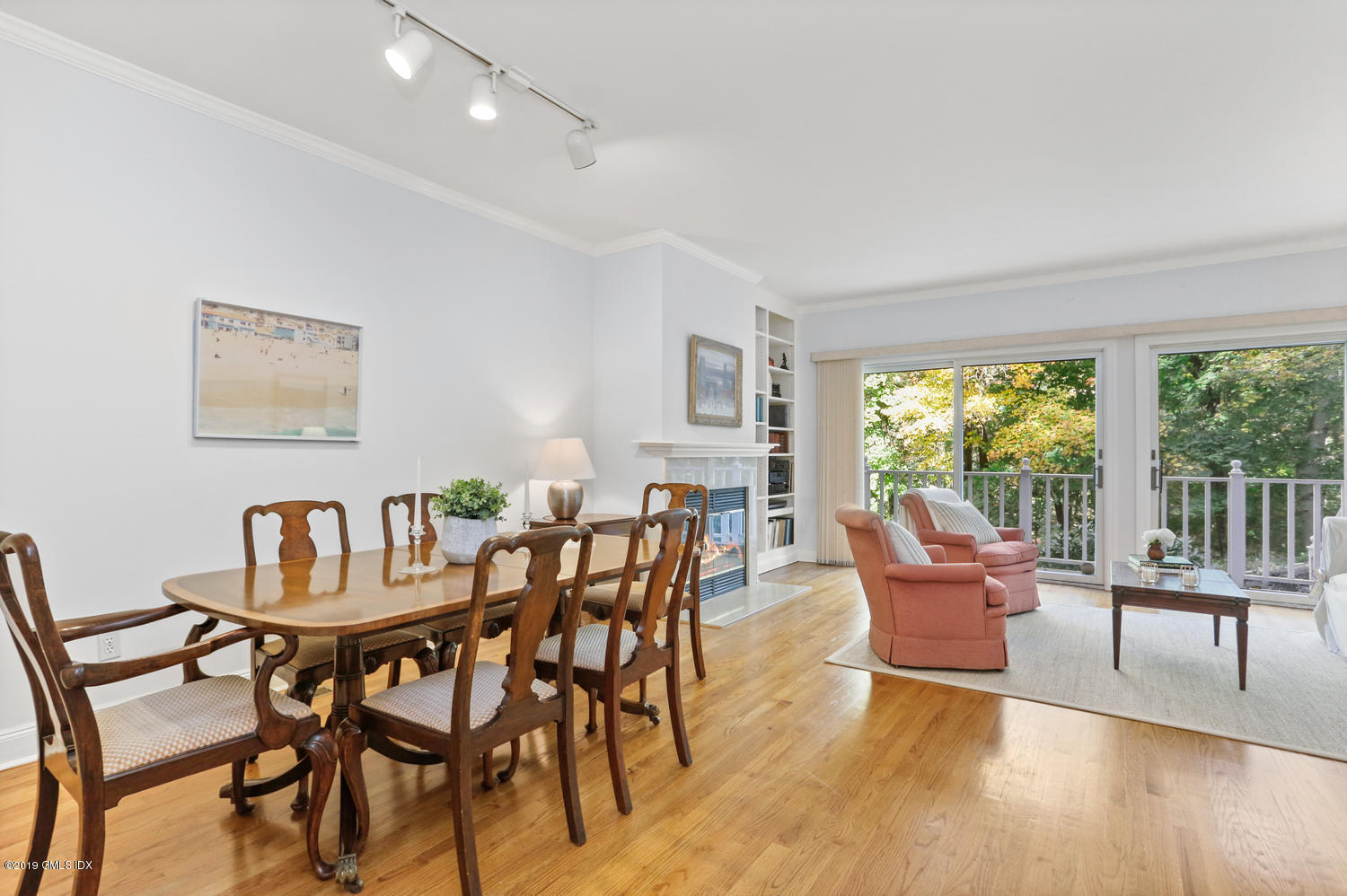 333 Palmer Hill Road, Unit 3C Riverside, CT 06878 - Photo 7 of 36 a dining room with furniture and wooden floor
