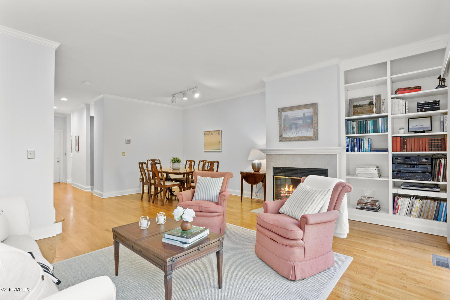 333 Palmer Hill Road, Unit 3C Riverside, CT 06878 - Photo 10 of 36 a living room with furniture and a book shelf
